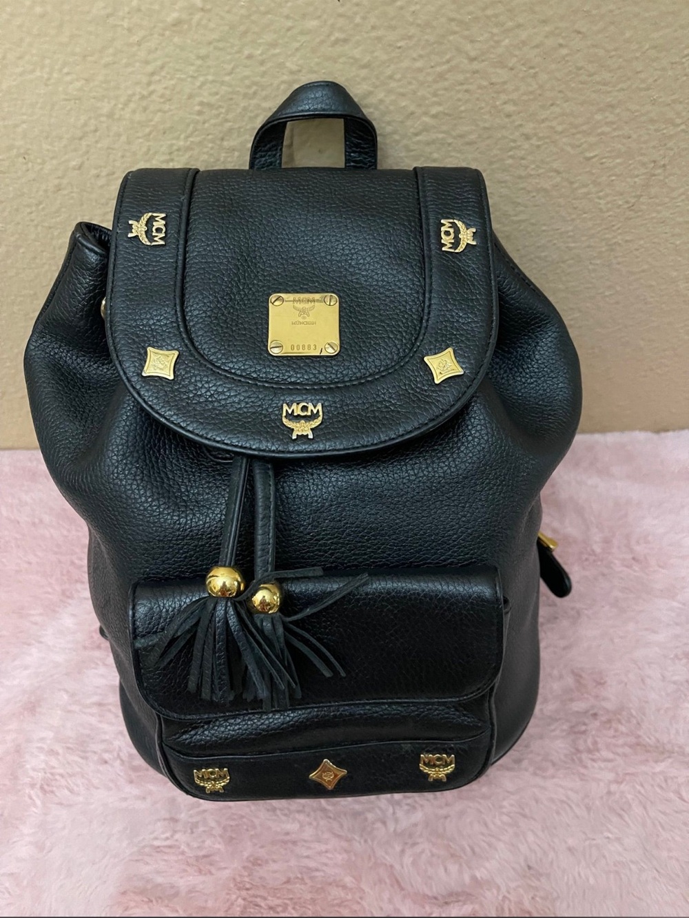 MCM Black Leather Backpack with Gold Hardware and Tassel Drawstring